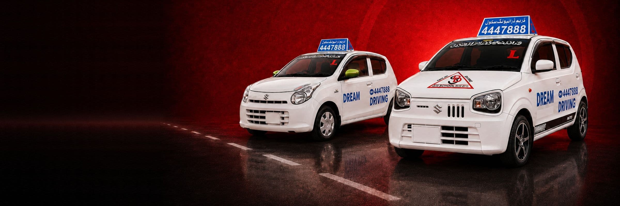 Both Suzuki Alto automatic training cars on the road